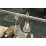 Pair of cut glass scent bottles with silver mounted necks (2)