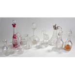 Assortment of decanters and glass ware along with a cut glass claret jug with white metal lid and