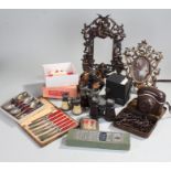 Mixed collection of objects including two brass picture frames, cutlery, binoculars and a