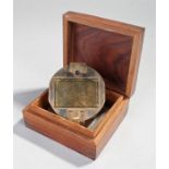 Brass compass, the hinged case enclosing the compass, housed within a anchor inlaid case