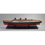 1930's model of the RMS Queen Mary, with three red funnels above a series of decks and life boats,