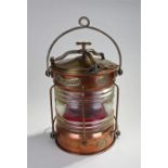 Cooper and brass ships lamp, by Eli Griffiths & Sons Ltd, Birmingham, with a swing handle to the