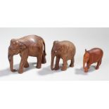 Three carved elephants, the largest 15cm long