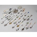 Silver plated spoon collection, some with enamel decoration, together with a cigar cutter and a
