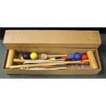 Boxed croquet set, with two clubs, balls and arches