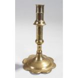 18th Century brass ejector candlestick with petal foot.