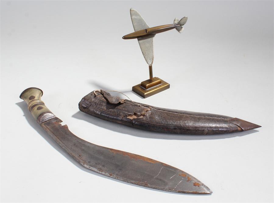 Model of a spitfire on stand, together with a kukri, (2)