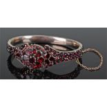 Victorian garnet set yellow metal bracelet, set with 142 garnets of different size and cuts, 63mm