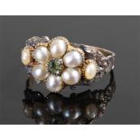 Late 18th/early 19th Century pearl ring, the pearls set around a peridot with an engraved foliate