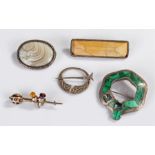 Collection of silver brooches, to include a silver and malachite example, a Celtic style example, an