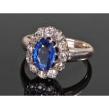 White metal diamond and sapphire, the central sapphire surrounded by twelve diamonds, ring size O