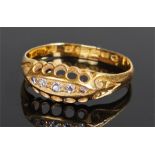 18 carat gold diamond set ring, the ring with a row of five diamonds to the pierced head, ring