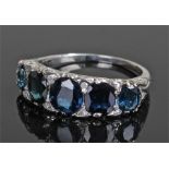 Sapphire and diamond ring, the row of five sapphires at approximately 2.50 carats, diamonds to the