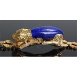 French 18 carat gold lapis lazuli bracelet, the lapis lazuli carved to form the body of a gold dog