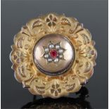 9 carat gold brooch, the circular brooch with a central boss with pearls, foliate border with