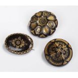 Three Victorian tortoiseshell and pique work brooches, of circular form with gold and silver