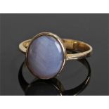 18 carat gold star sapphire ring, the star sapphire set within an oval mount, ring size N