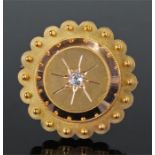 Victorian yellow metal and diamond set mourning brooch, the shaped circular brooch with a central