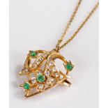 Yellow metal diamond and emerald pendant, the leaf shaped pendant with a flower head design, 26mm