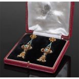 Pair of gold and turquoise set drop earrings, with a ribbon tied tip above turquoise set beams and a