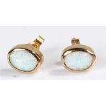 Pair of 9 carat gold opal set earrings, with oval opals set within mounts, 9mm high