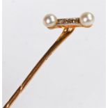 Yellow metal and pearl stick pin, 7cm high