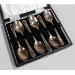 Cased set of six silver spoons, each with ribbon and swag decoration, 1.9oz