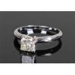 White gold and diamond set solitaire ring, the central square cut diamond at 1.15 carat, ring size