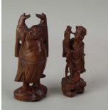 Zwei Holzfiguren - China,Holz geschnitzt und lackiert,jeweils 1 eingesetztes Auge fehlt,H.ca.14,5/