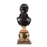 A bronze bust of the young Napoleon,   with marble socle and lacuered brass base, chip to head of