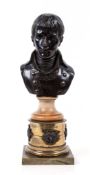 A bronze bust of the young Napoleon,   with marble socle and lacuered brass base, chip to head of