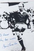 CHARLTON, BOBBY - Black and white photograph of Bobby Charlton scoring a goal  Black and white