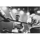 ALI, MUHAMMAD - Black and white photograph of Muhammad Ali in the ring with his...  Black and