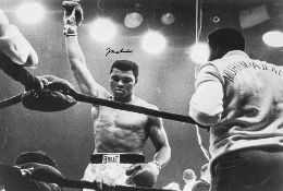 ALI, MUHAMMAD - Black and white photograph of Muhammad Ali in the ring with his...  Black and