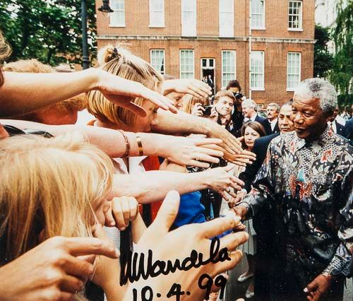 MANDELA, NELSON - Colour photograph of Nelson Mandela and Thabo Mbeki embracing  Colour photograph