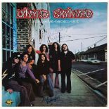 LYNYRD SKYNYRD - Vinyl copy of the band's debut album , signed on sleeve cover by...  Vinyl copy