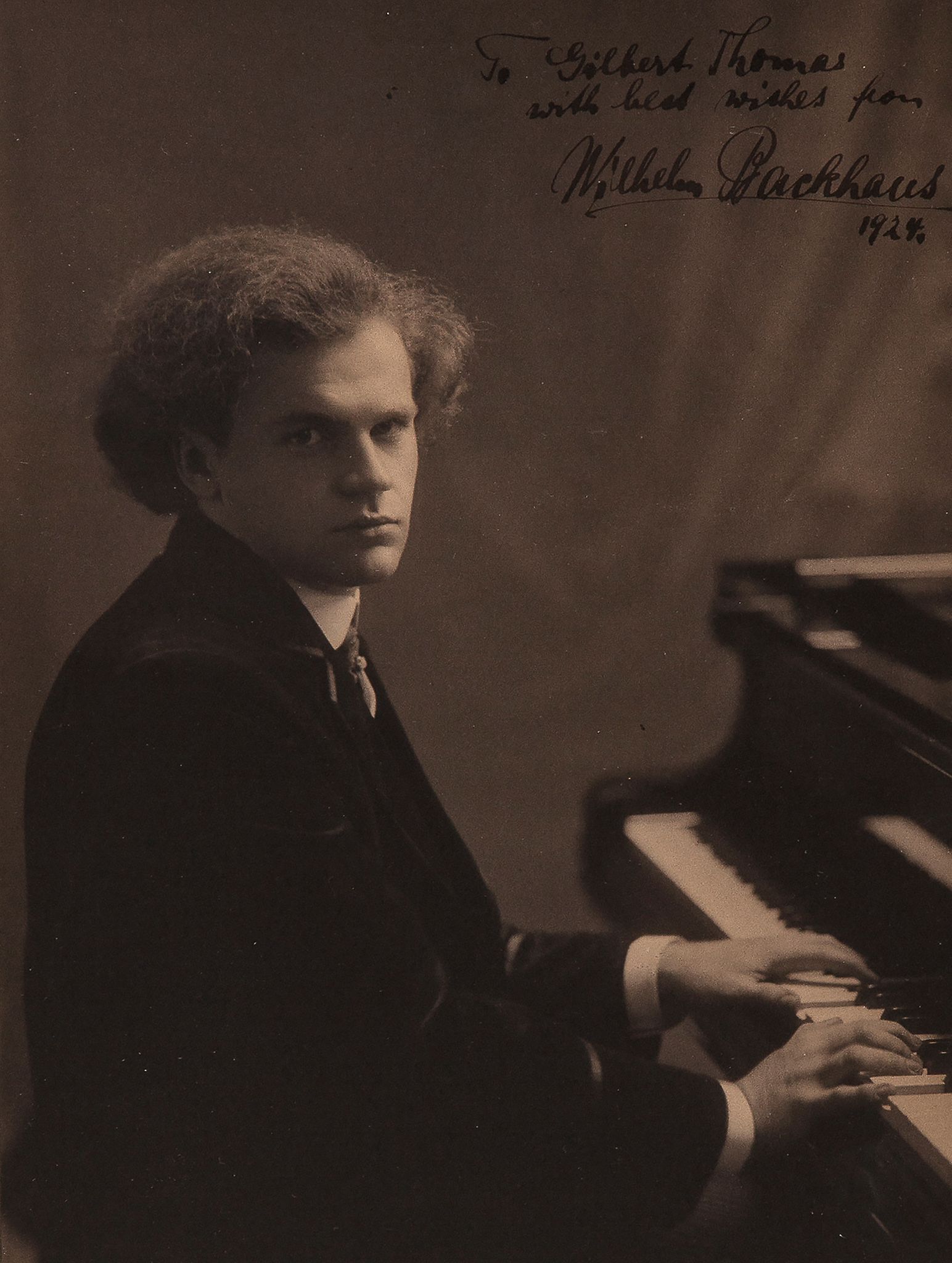 BACKHAUS, WILHELM - Vintage, sepia toned photograph of Wilhelm Backhaus seated at the...  Vintage,