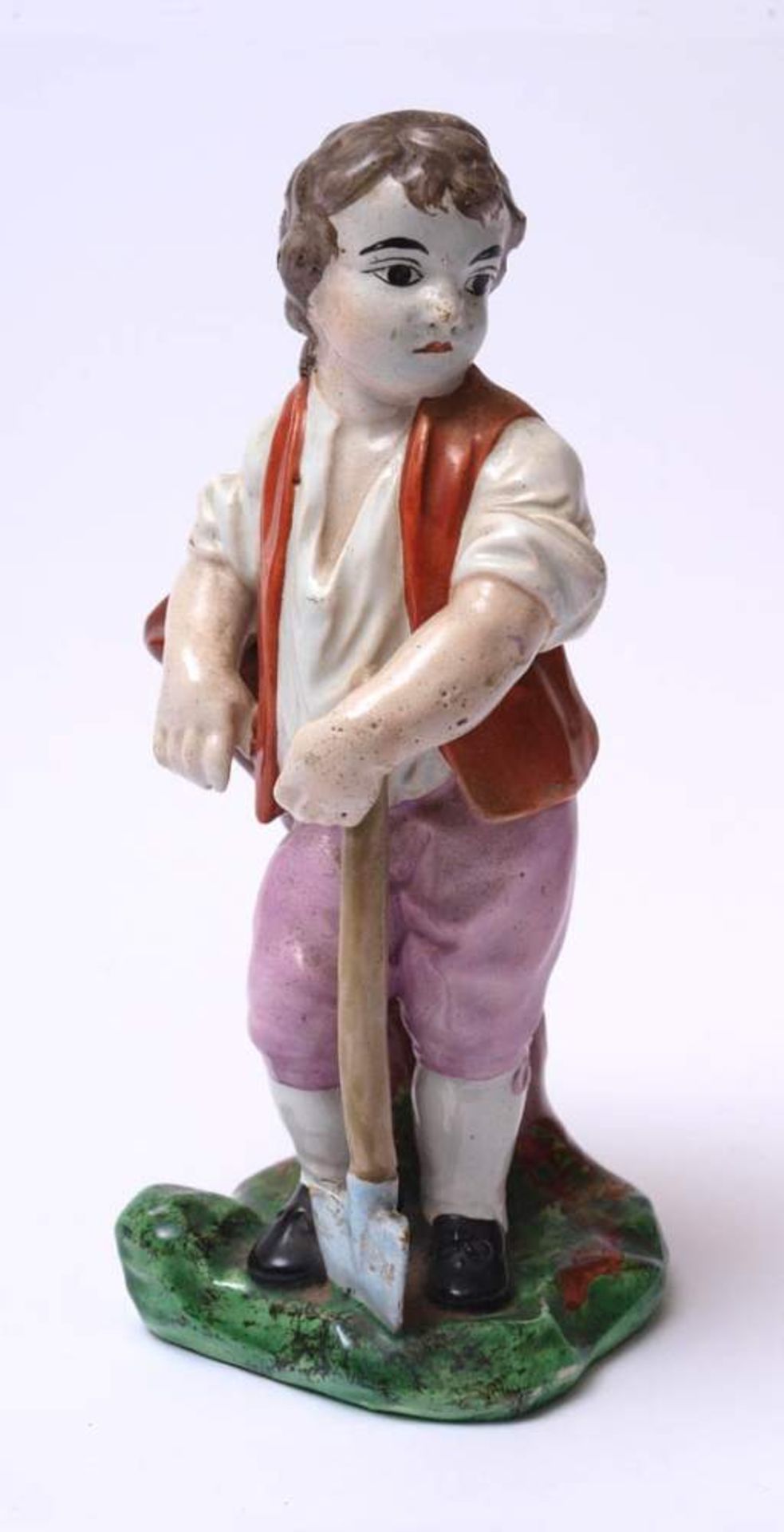 Figurine, wohl Niderwiller, 2. Hälfte 18.Jhdt.Auf naturalistischem Sockel jugendlicher Bauer mit