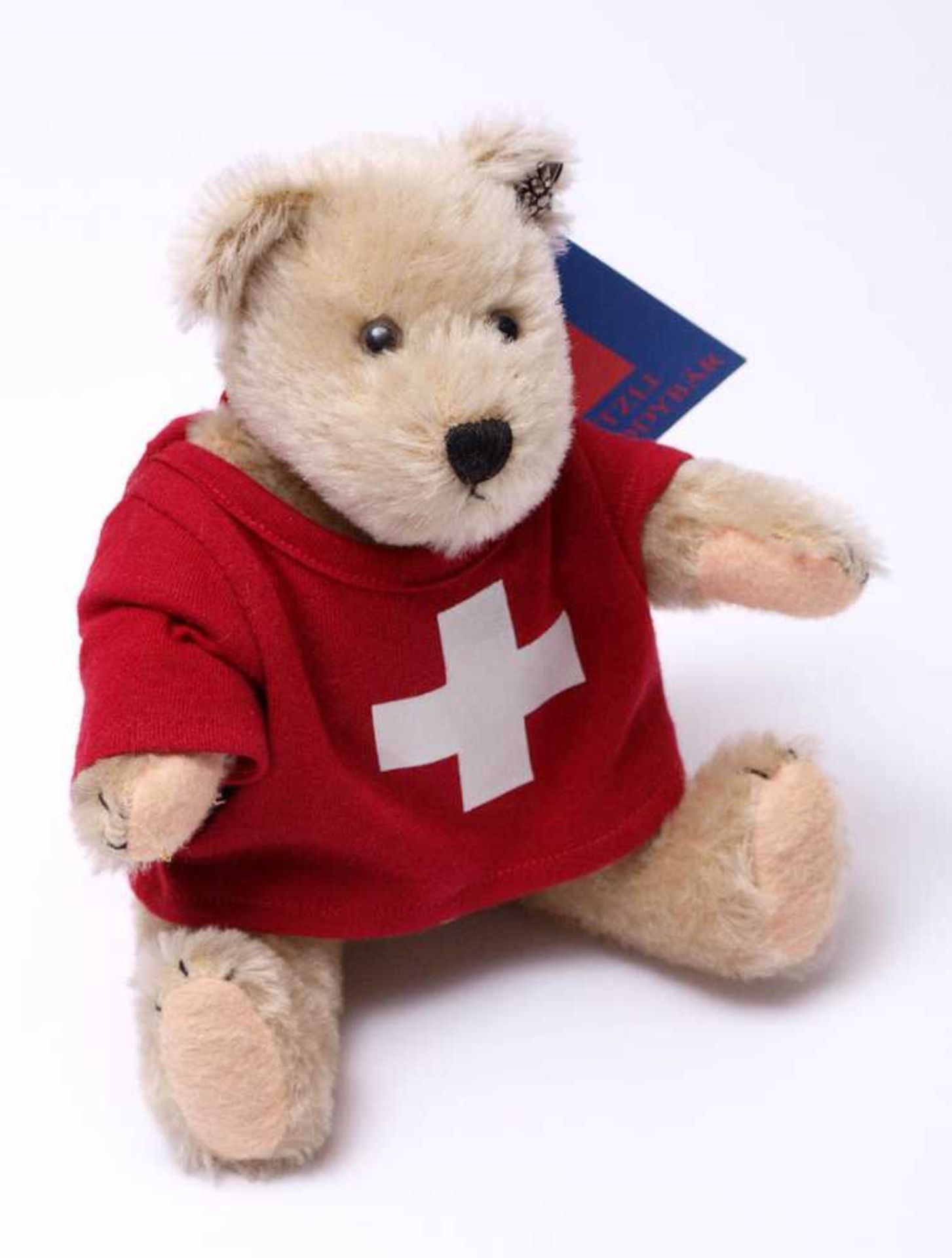 Teddybär Swiss MutzliUnbespielt, mit originaler Kleidung und Edelweiss. Limitierte Auflage, Ex.