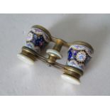 A fine quality pair of Opera Glasses, with decorative porcelain mounted with mother-of-pearl trim,