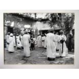 An interesting framed and mounted middle-Eastern interest photographic Print, depicting a busy Souk,