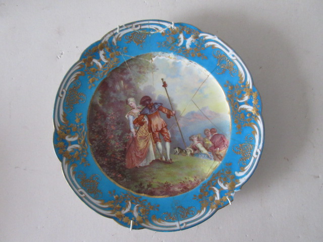 An early C19th Cabinet Plate, hand-painted with a couple in a countryside scene, note A/F with (old)