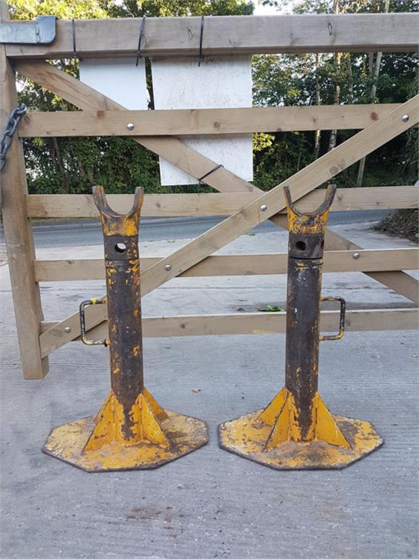 PAIR OF YELLOW ADJUSTABLE COIL DRUM JACKS/STANDS. LOCATION: GATWICK, UK