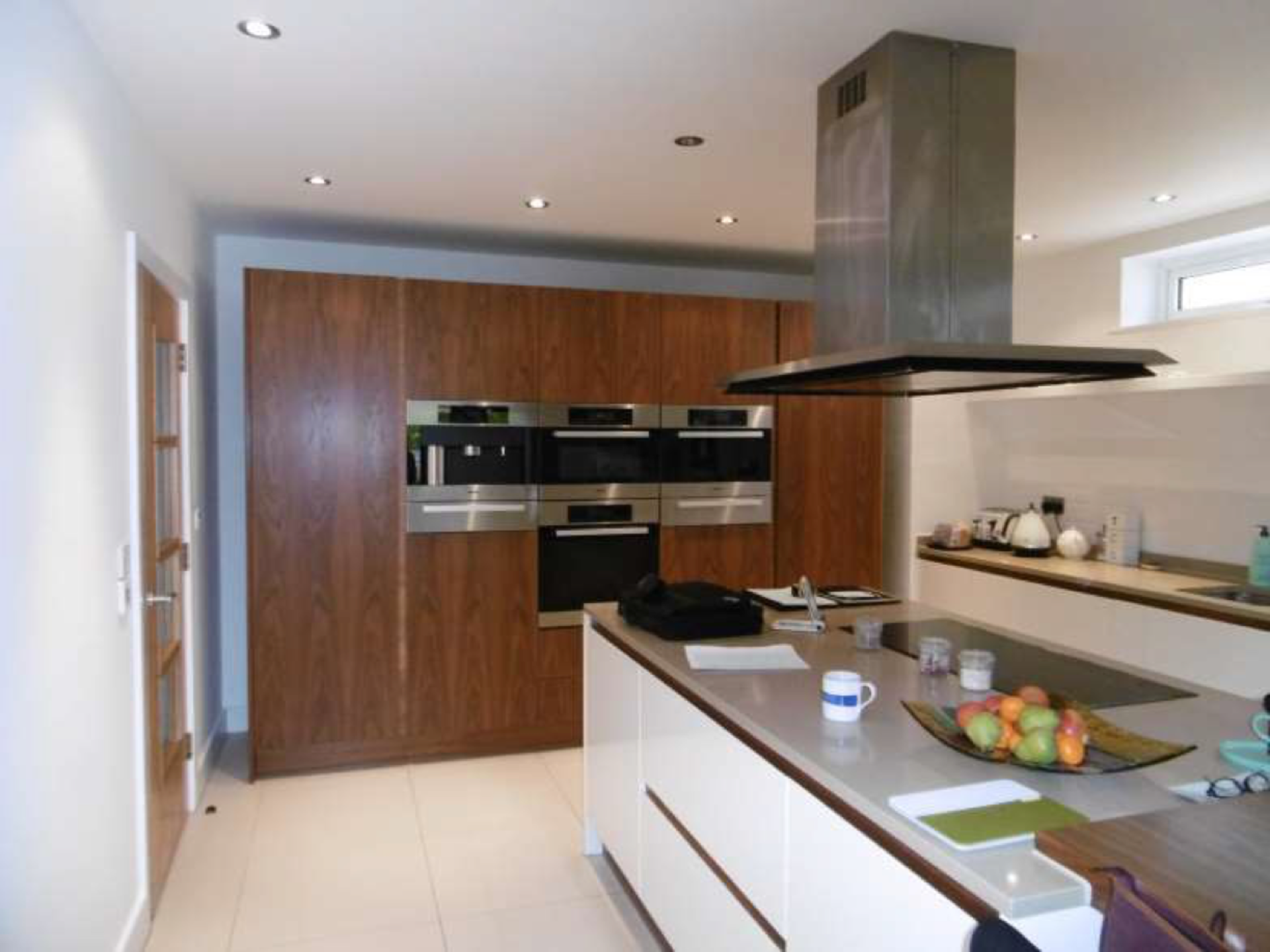 Luxury Contemporary High Glass Cream and Cherry Kitchen with Extensive range of Miele Appliances.
