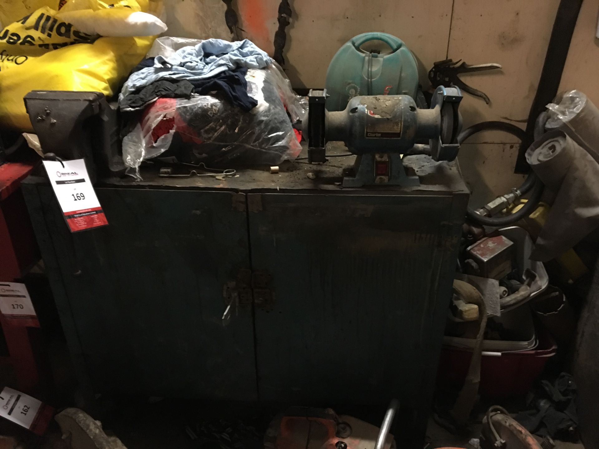 Metal 2 door cabinet, Clarke double ended grinder, vice and cabinet contents