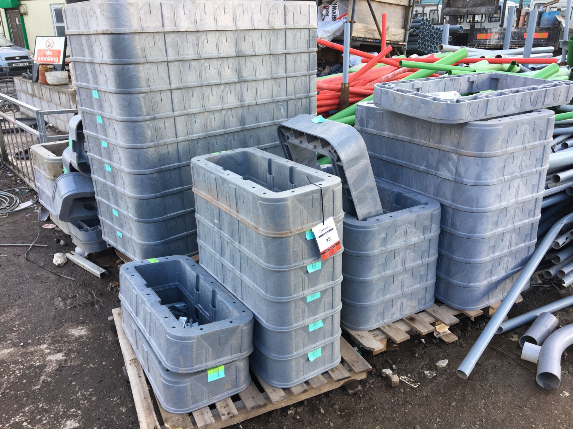 4 x pallets of grey plastic 'Radius Quad boxes' (approx. 22 pieces in various sizes)