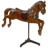 Early Carousel Horse, c. 1900 Fine carved limewood, wooden ornaments, inset glass eyes, carved tail.