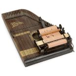 "Triola" Mechanical Zither, 1919 onwards Manufactured by Paul Riessner, for 25-note paper rolls,