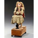 Musical Automaton Magician by Louis Renou, c. 1900 With French bisque head, closed mouth, fixed