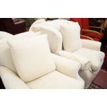 A Chesterfield sofa; three various easy chairs; a pouffe (currently covered in ivory cotton); and